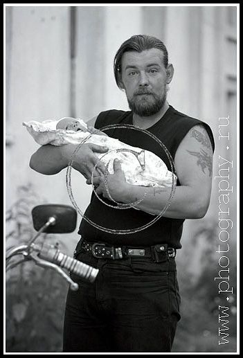 Motor-biker Sergey Tikhiy with son. Moscow suburb.